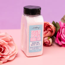 Load image into Gallery viewer, A bottle of YUM YUM BUBBLE GUM BUBBLING BATH SALTS with pink bath salts visible through the transparent bottle. The label has a pink and blue design with text.