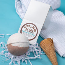 Load image into Gallery viewer, Root beer float bath bomb with packaging on a blue background