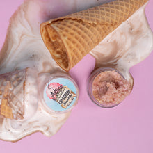 Load image into Gallery viewer, Lip scrub with a waffle cone and shell on a pink background