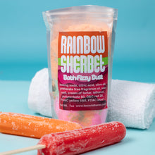 Load image into Gallery viewer, Packaged rainbow sherbet bath fizzy dust with two colorful bath bombs on a blue background