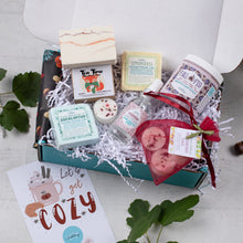 Load image into Gallery viewer, Gift box with bath products and a card on a light background