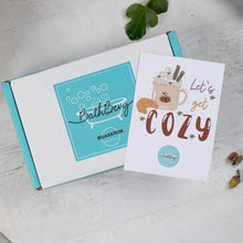 Load image into Gallery viewer, Open box with a &#39;BathBerry&#39; label and a &#39;Let&#39;s get cozy&#39; card on a light gray surface.