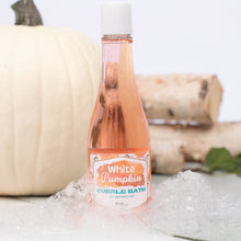 Load image into Gallery viewer, Bottle of &#39;White Pumpkin&#39; bubble bath with pumpkins in the background